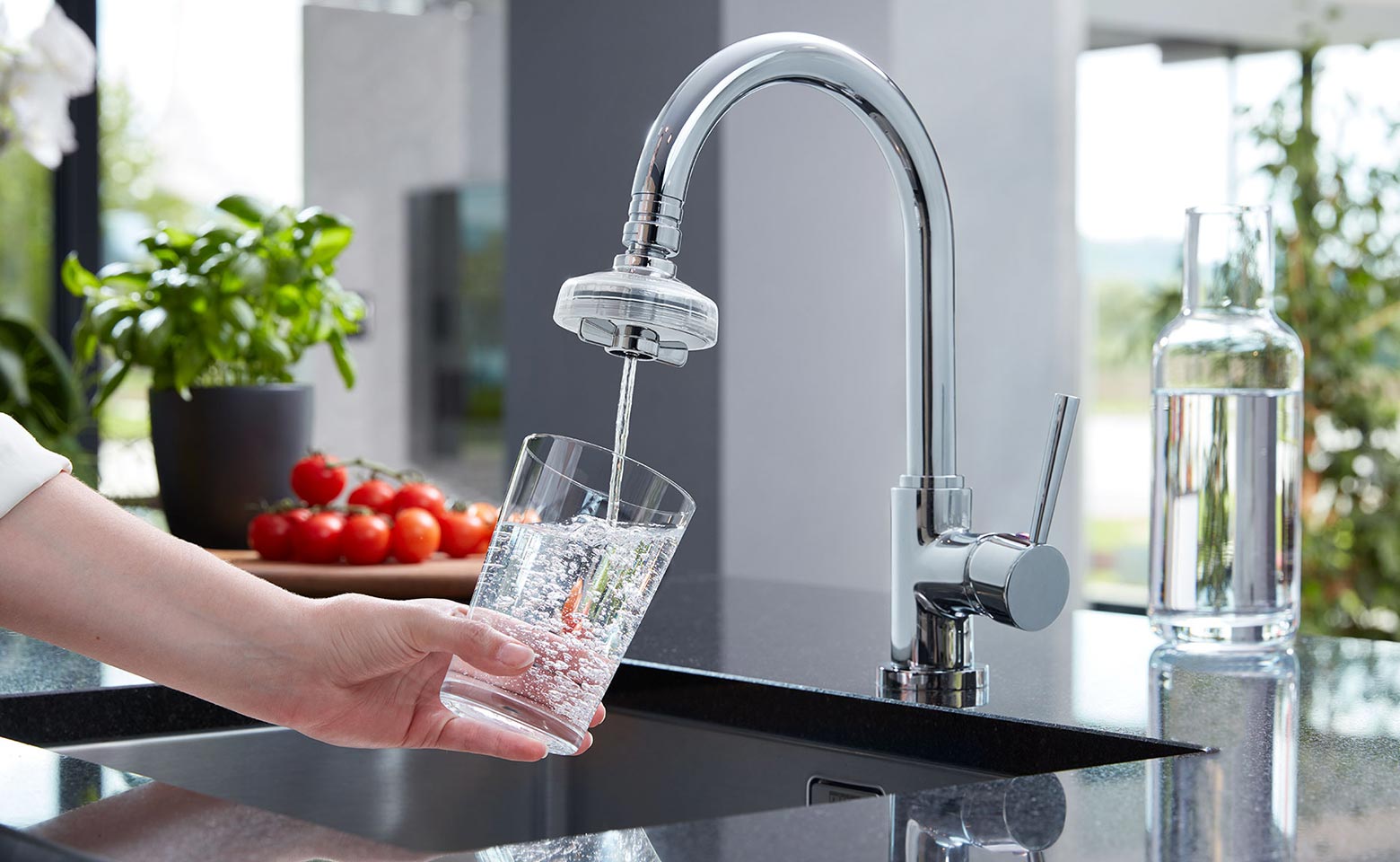 Woman pouring water from the tab