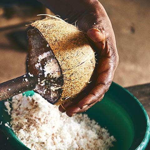 Taking the coconut pulp out of the coconut