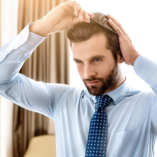 Man brushing his hair