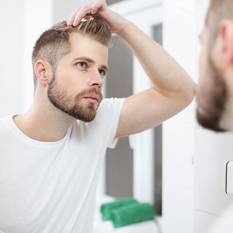 Man looking in the mirror