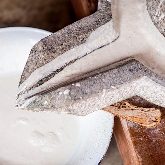 Knife carving coconut pulp