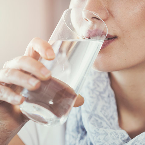 Woman drinking a glass of water