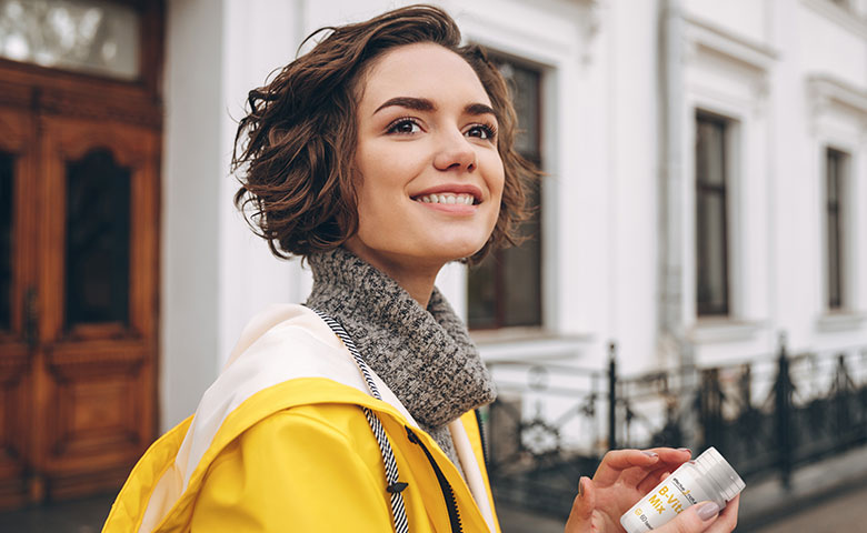 Woman with B vitamin mix in her hands